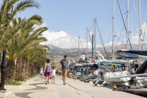 People stroll along the promenade of Argostoli in the Greek island of Kefalonia.